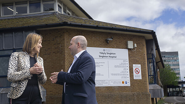 Sam Bennett and Jane Dodds MS speaking outside Singleton Hospital