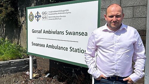 Cllr Sam Bennett outside Swansea Ambulance Station