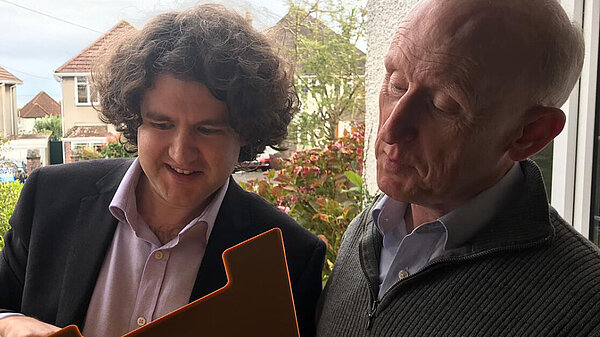 Volunteer Speaking to Resident on Doorstep