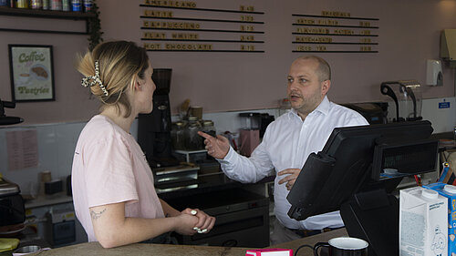 Sam talking with Cafe staff