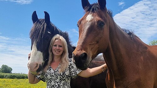 Cllr Beth Rowe with her two horses