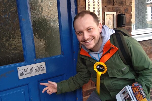 Sam Bennett with a FOCUS leaflet to deliver to Radnor House. 