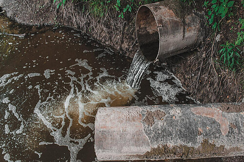 Sewage overflowing into a water course